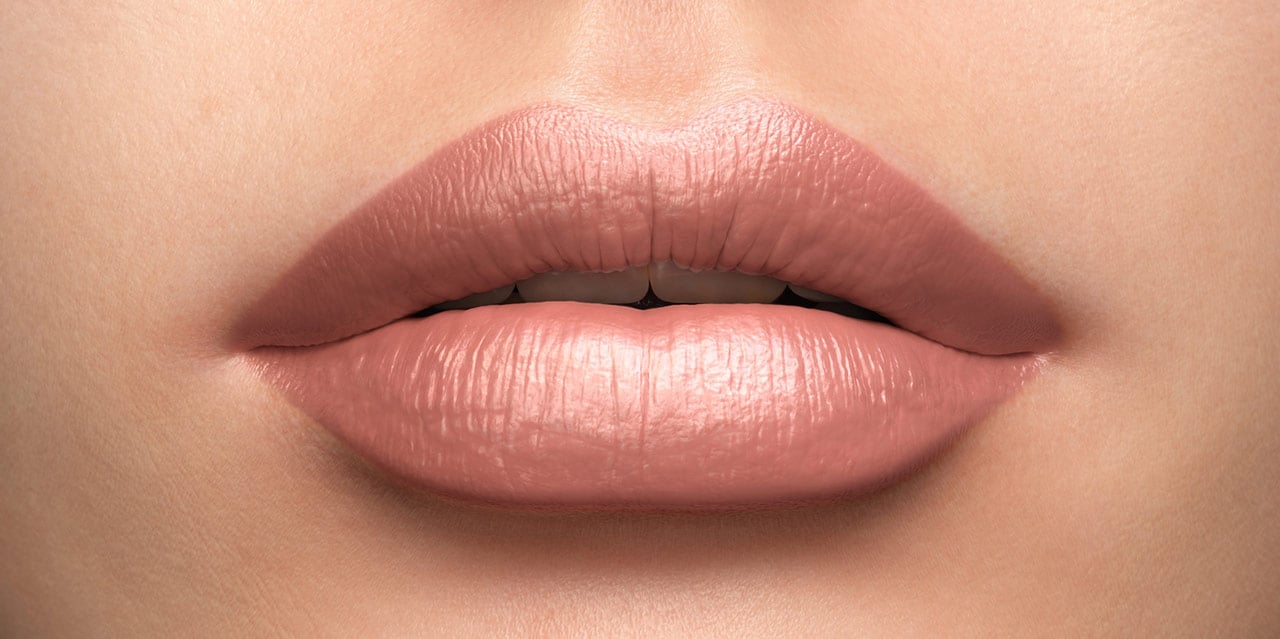 Cool Pinky Nude Lipstick worn on a pale porcelain light skin tone 
